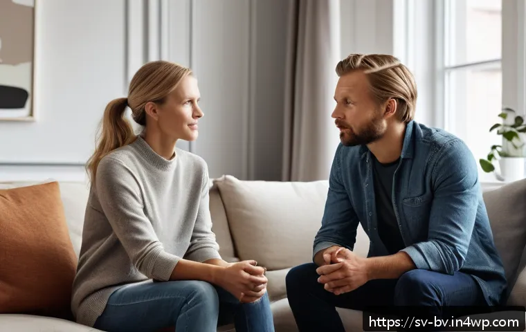 커뮤니케이션에서 공감 능력 향상하기 - A warm and inviting Scandinavian living room scene showing two adults engaged in a deep conversation...