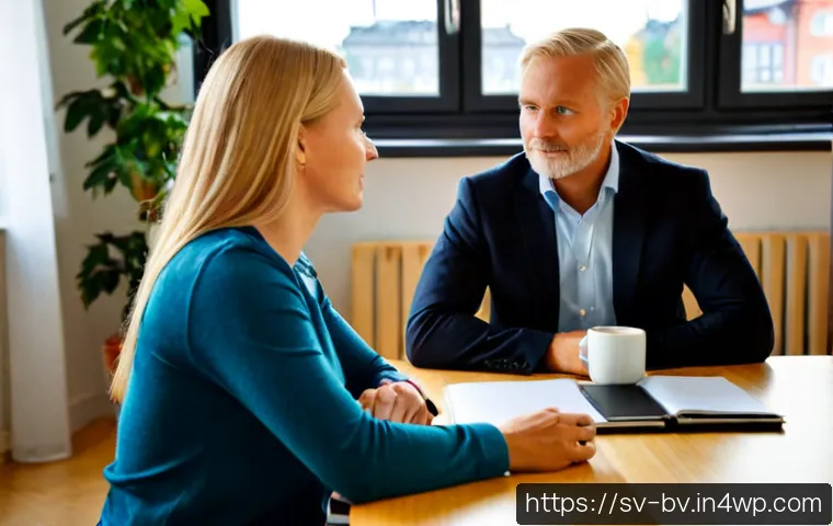 Home 15 상대방과의 관계를 개선하는 대화법 - Photorealistic Swedish workplace conversation, two middle-aged colleagues seated across a light wood...